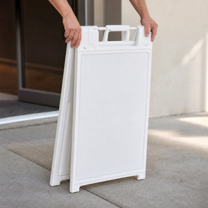 A-Frame Stands in use - being folded flat by two hands