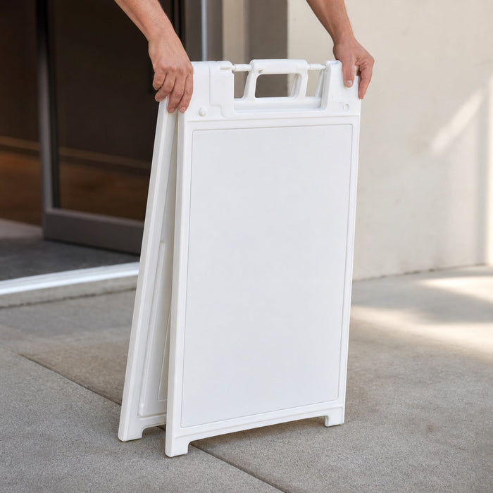 A-Frame Stands in use - being folded flat by two hands