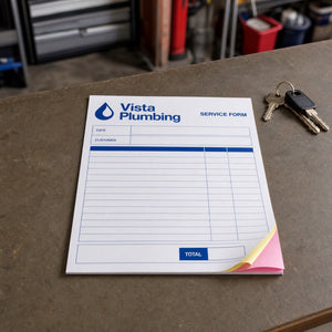 Carbonless NCR Forms in use - on a garage desk beside a set of keys