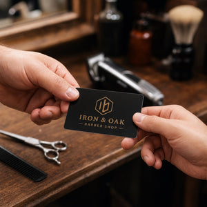 Durable Business Cards in use - being handed across a workbench in a barber shop