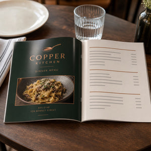 Glossy Booklets 8.5x5.5 in use - open on a restaurant table as a menu