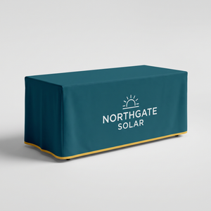 Custom fitted table cover with boxed corners on a 6 ft table, teal print with logo