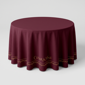Custom printed round tablecloth on a 36 inch round table, burgundy with gold border and logo