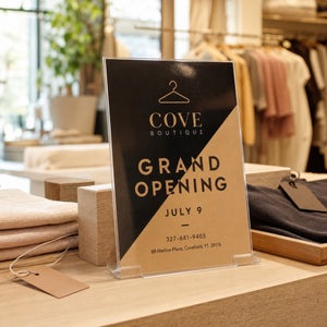 High-Gloss Invitations in use - propped on a shop counter at a grand opening