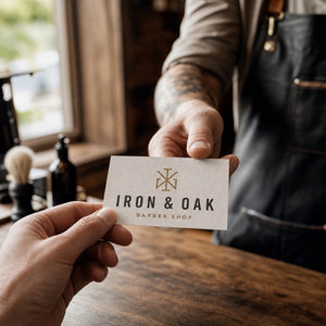 Linen Business Cards in use - being handed across a workbench in a barber shop
