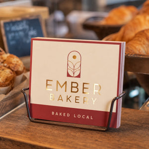 Metallic Foil Postcards in use - in a rack on a bakery counter
