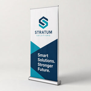 Pull-Up Banner with silver base printed as a corporate lobby banner with a logo mark and a short brand statement