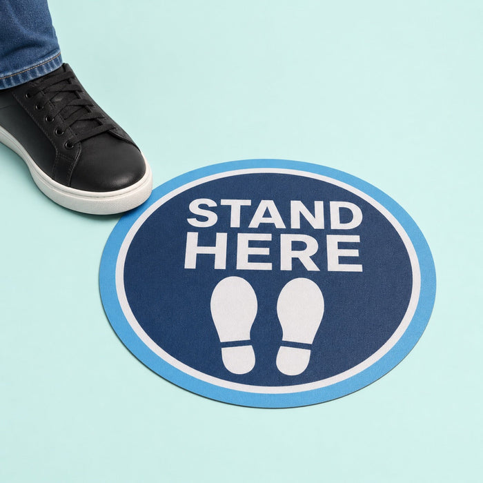 Anti-Slip Floor Decals held in hand showing its 12 inch circle size