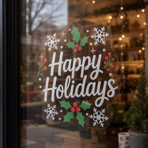 Clear Window Clings in use - on a shop window in December with warm lights softly behind
