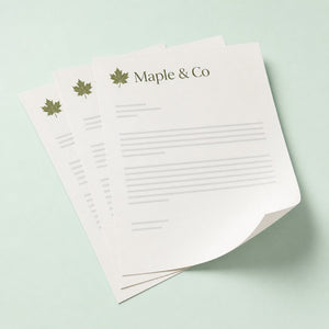 Custom Letterhead printed on 70lb uncoated smooth text paper, 8.5 x 11 inches, shown at an angle