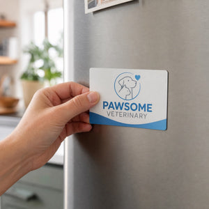 Custom Magnets in use - being pressed onto a kitchen fridge by one hand