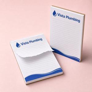 Custom Notepads (25 Pages) printed on 25 sheets of 70lb uncoated text glued to a rigid chipboard backer, 5.5 x 8.5 inches, shown at an angle