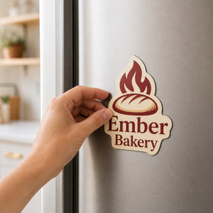 Cut to Shape Magnets 20mil in use - being pressed onto a kitchen fridge by one hand