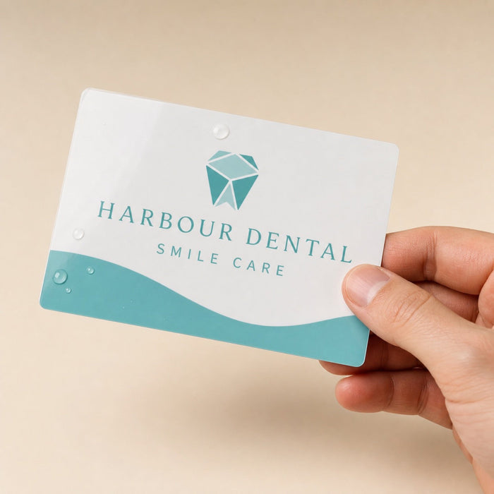 Durable Postcards held in hand showing its 4 x 6 inches size