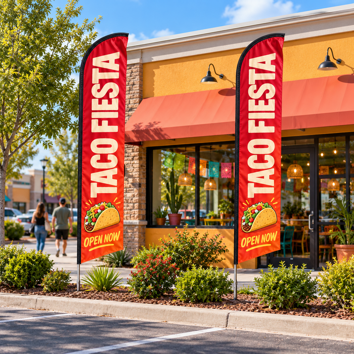 Two econo feather flags outside a taco shop
