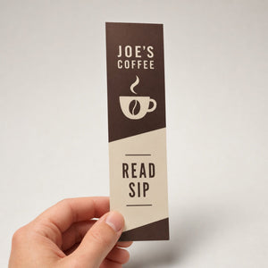Economy Bookmarks held in hand showing its 2 x 6 inches size