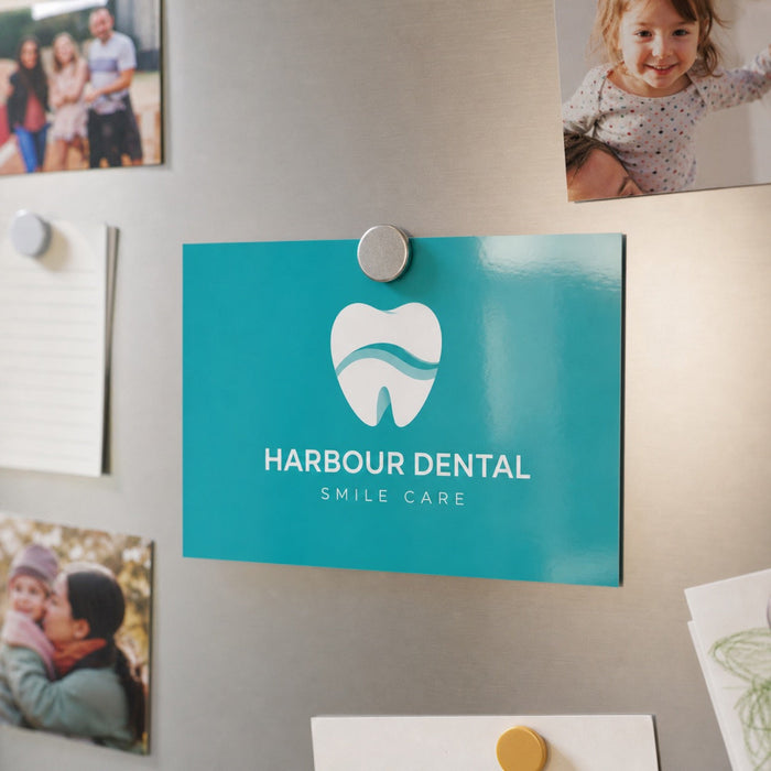 Economy Glossy Postcards in use - pinned to a fridge door with a magnet among a few family photos