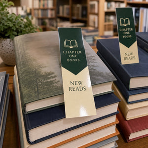 Gloss Laminated Bookmarks in use - in a stack of new releases on a bookshop table