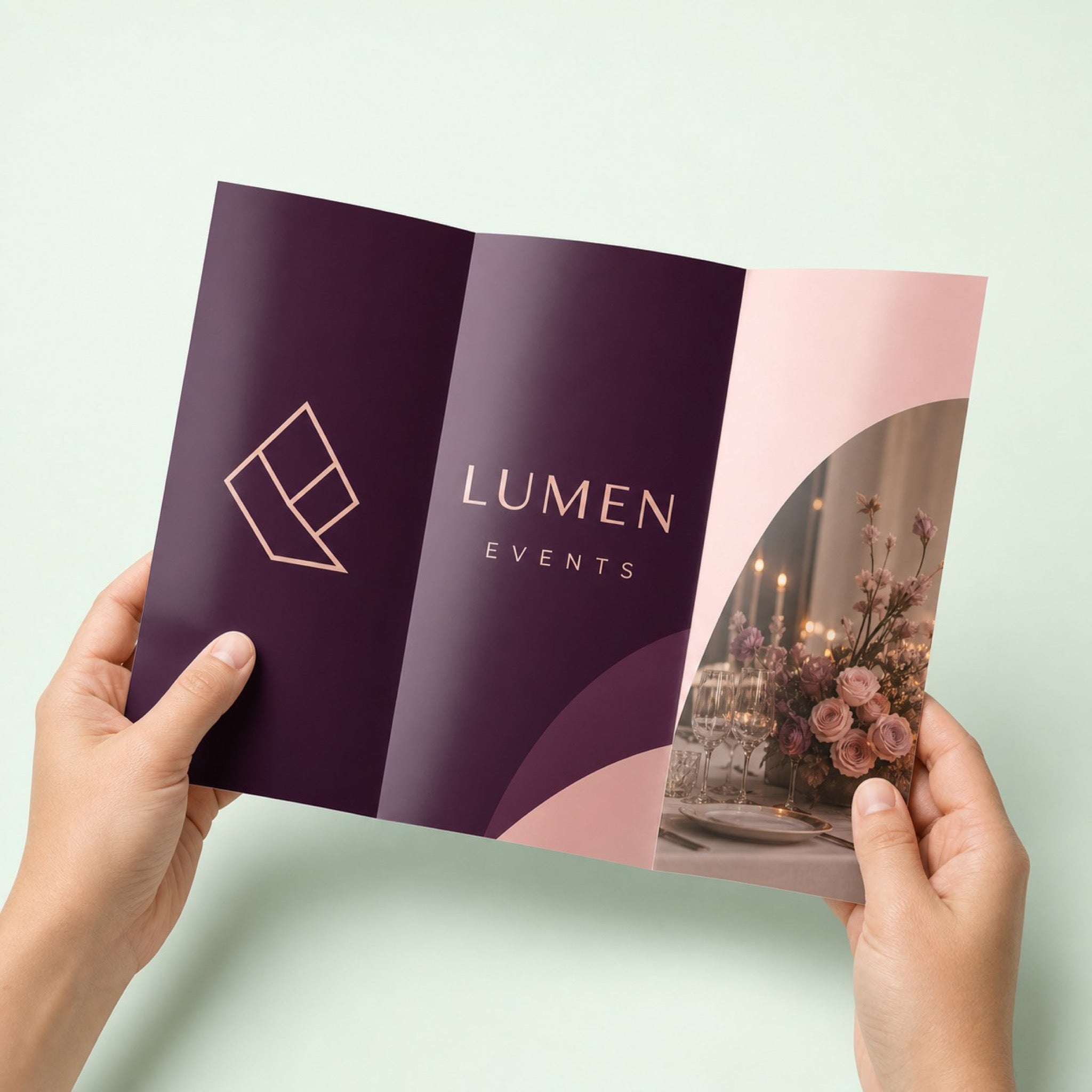 Glossy Brochures held in hand showing its 11 x 8.5 inches folded size