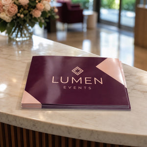 Glossy Brochures in use - in a stack on a venue reception desk