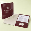 Glossy Presentation Folders printed on 14PT card stock, die-cut with glued pockets and a business card slit, 9 x 12 inches closed, shown at an angle
