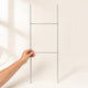H-Stands for Yard Signs held in hand showing its 10 x 30 inch wire stake size