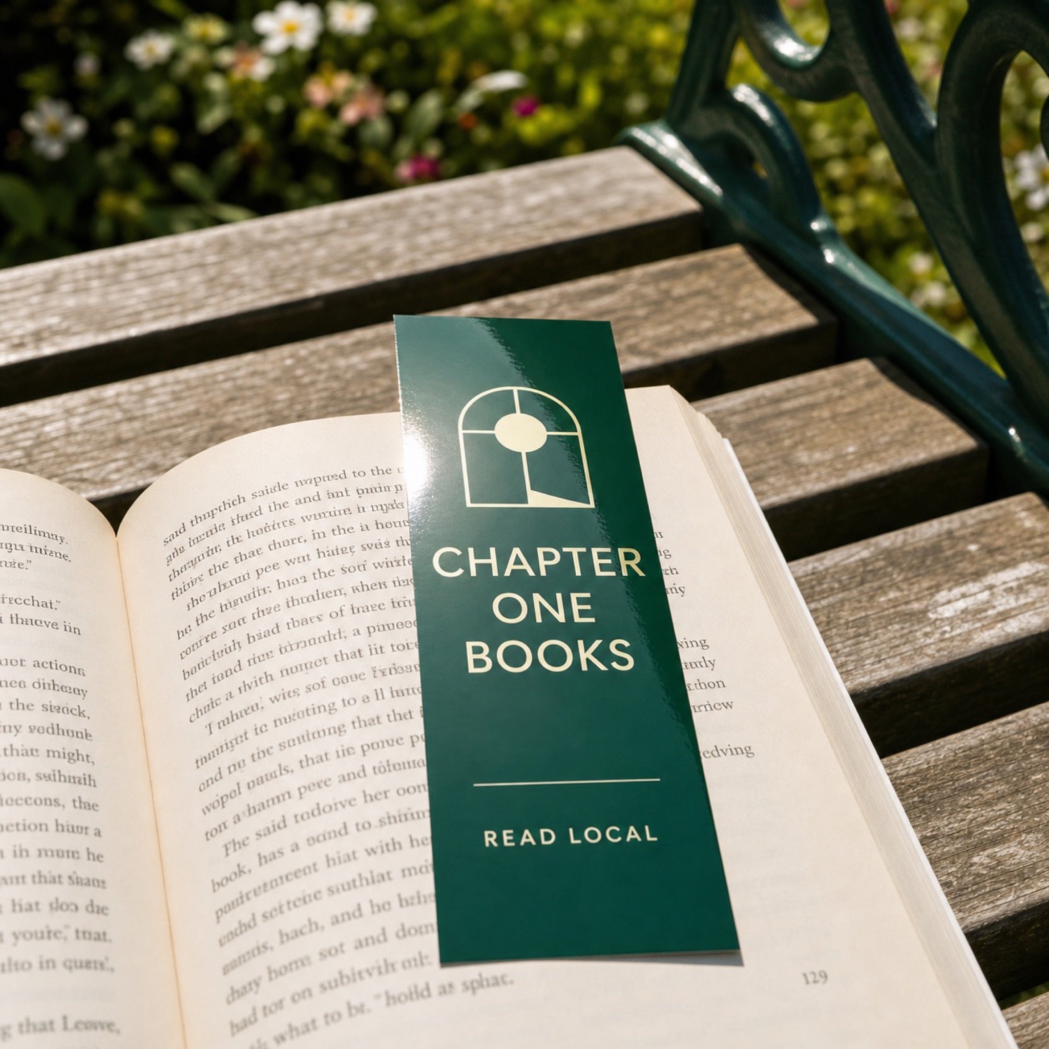 High-Gloss Bookmarks in use - in a paperback on a garden bench in sunlight