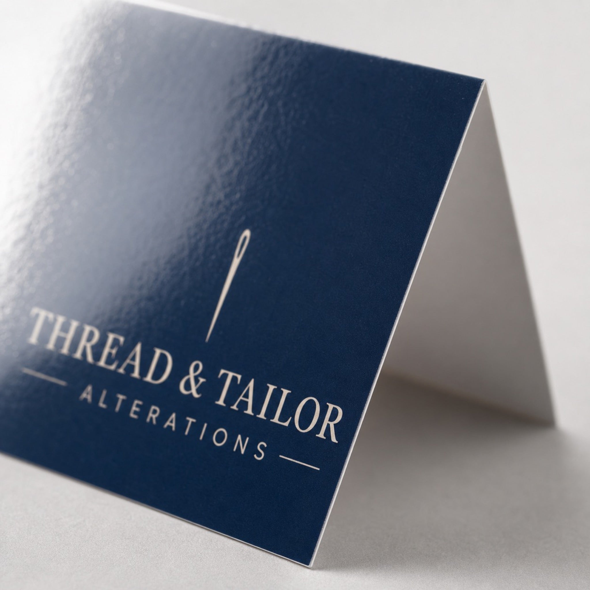 Close-up of the mirror high-gloss UV coating on High-Gloss Folded Business Cards