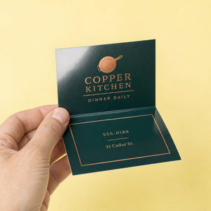 High-Gloss Folded Business Cards held in hand showing its 3.5 x 4 inches flat, folding down to 3.5 x 2 inches size
