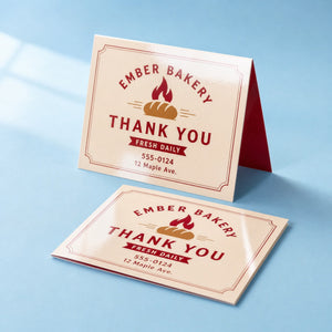 High-Gloss Greeting Cards printed on 14PT card stock, scored and folded, 10 x 7 inches flat, folding to 5 x 7 inches, shown at an angle