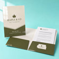 High-Gloss Presentation Folders printed on 14PT card stock, die-cut with glued pockets and a business card slit, 9 x 12 inches closed, shown at an angle