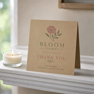 Kraft Paper Greeting Cards in use - standing open on a mantelpiece beside a small candle