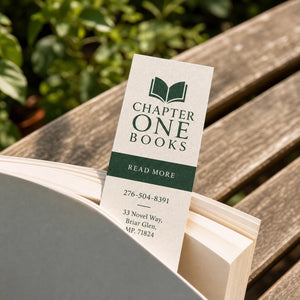 Linen Bookmarks in use - in a paperback on a garden bench in sunlight