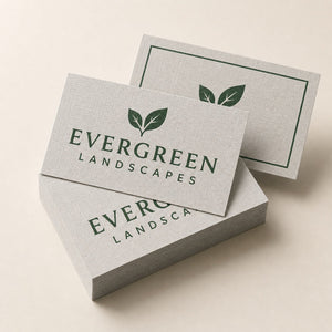 Linen Business Cards printed as a landscaping card, forest green on pale grey with a small leaf mark