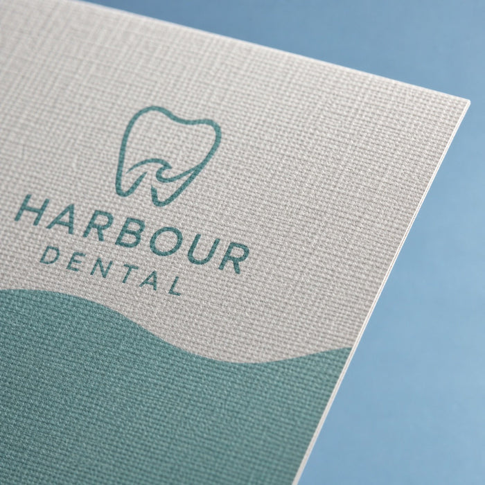 Close-up of the linen-embossed uncoated stock on Linen Postcards