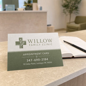 Linen Postcards in use - on a clinic reception desk beside an appointment book
