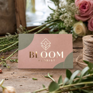 Metallic Foil Business Cards in use - on a florist's bench among cut stems and twine
