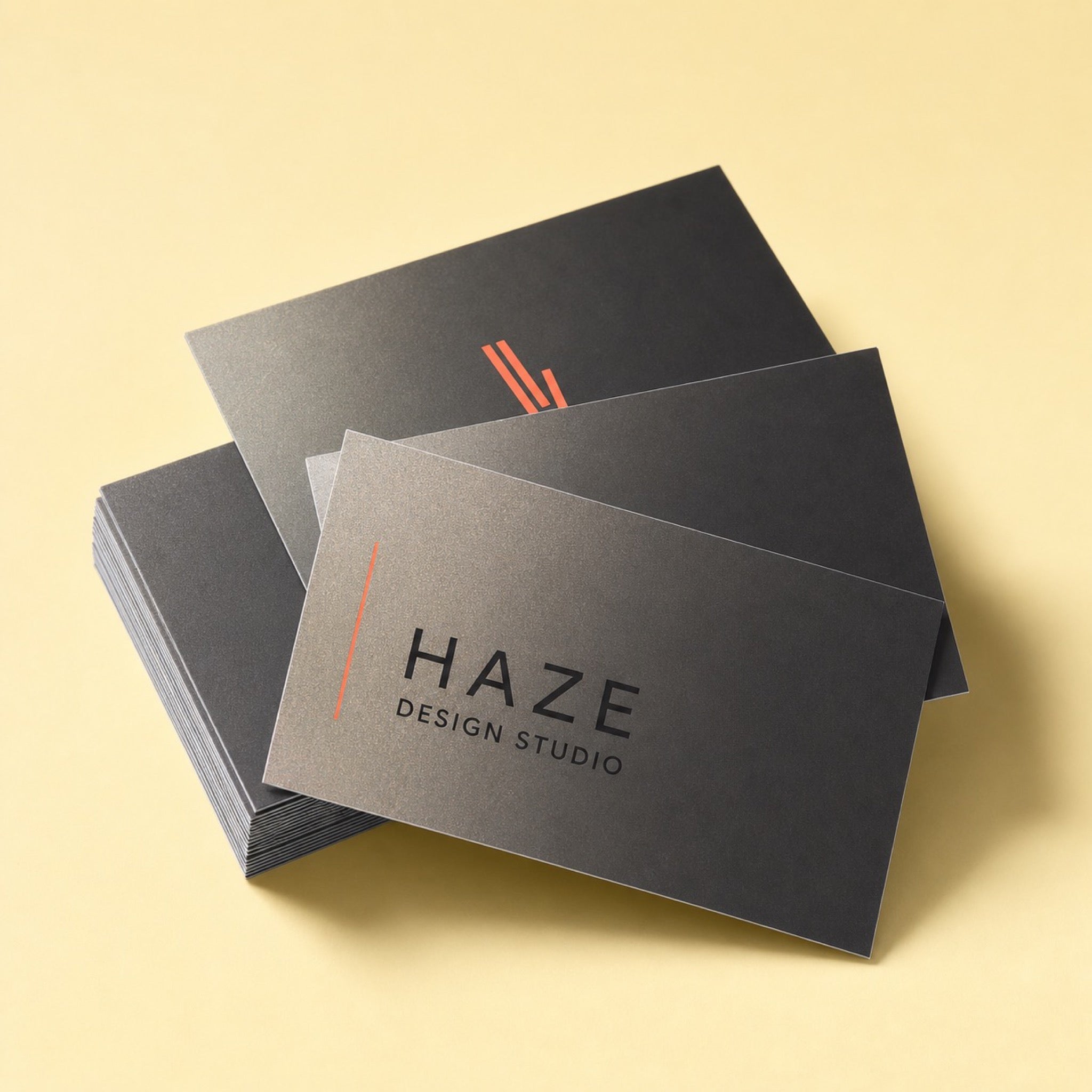 Pearl Business Cards printed as a design studio card, black with one bright coral accent, very minimal