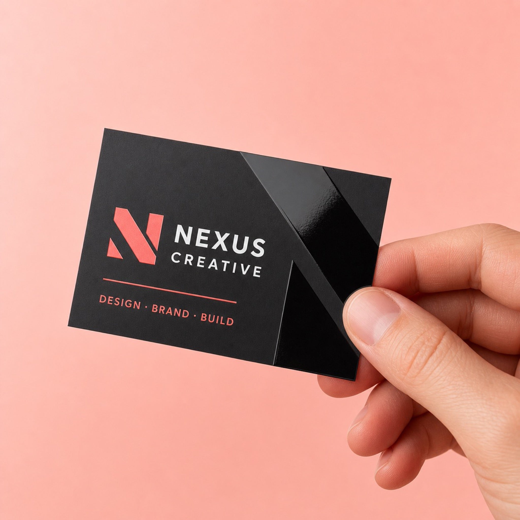 Spot UV Business Cards held in hand showing its 3.5 x 2 inches size