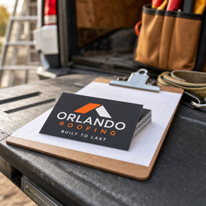 Standard Business Cards in use - resting on a clipboard on the tailgate of a work van