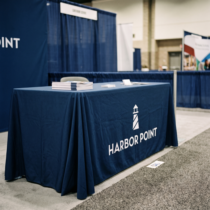 Printed table throw in use at a trade show exhibition booth