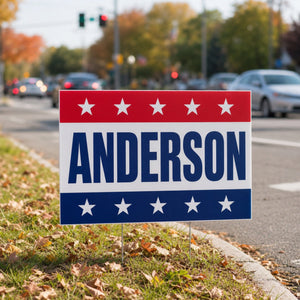 Yard Signs in use - pushed into a verge at a busy junction on a bright autumn day